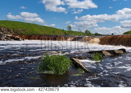 Waterfall On The Tosno River With Rapids And Stony Shore.  Sablino. Leningrad Region. Russia.