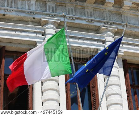 Big Italian Flag And European Community Flag Flying Outside The Building During The International Me