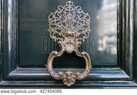 European Vintage Old Metal Wrought Iron Door Knocker. Design Detail. Paris.