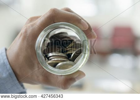 Businessman Saving Money Concept.