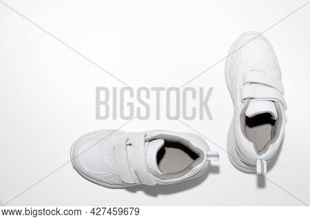 Mock Up White Childrens Sneakers With Velcro Fasteners For Easy Footwear Isolated On A White Backgro