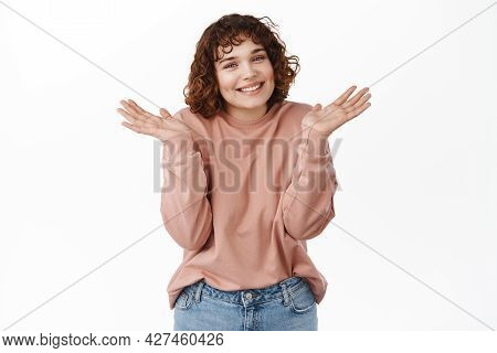 Oops Sorry My Bad. Smiling Coy Girl Shrugging Shoulders And Apologizing, Dont Know, Have No Clue Abo