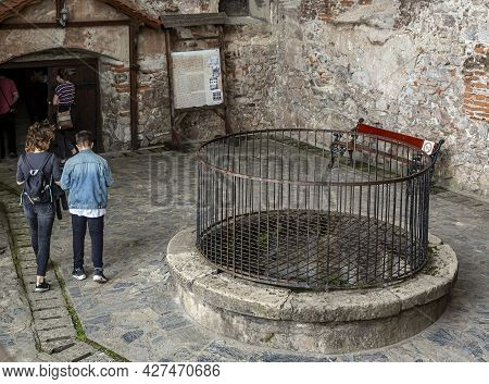 ​ Hunedoara, Transylvania, Romania -  May 31, 2021:  The Fountain Of The  Hunedoara Castle, Also Kno