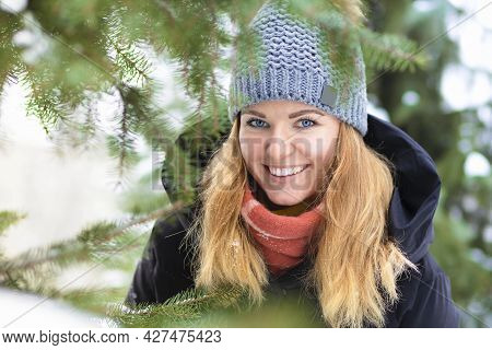 Portrait Beautiful Happy Girl Whitework Smile Teeth, Blue Eyes On Spruce Background In Frosty Day. A