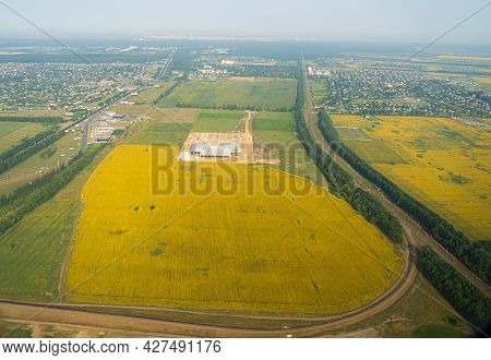 Land View Through The Airplane Window. Fields, Roads, Rivers From A Birds Eye View. Porthole. Look O