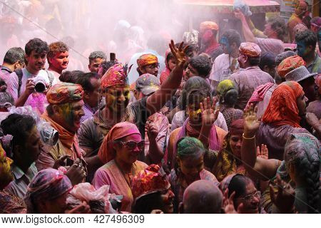 Dwarka, India - March 21, 2019: People Celebrating The Festival Of Colros - Holi In A Temple At Dwar