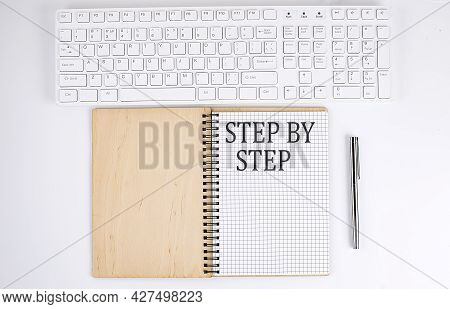 Step By Step Text On The Notebook With Keyboard On The White Background