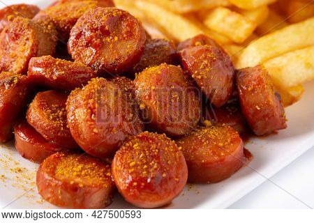 Traditional German Currywurst Isolated On White Background, Typical Oktoberfest Food.suasages With K