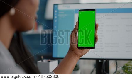 Close-up Of African Woman Holding Mock Up Green Screen Chroma Key Phone With Isolated Display In Han