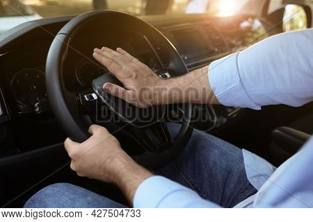 Man Pressing Horn In Car, Closeup. Aggressive Driving Behavior