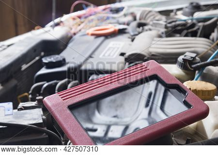 A Scanner For Car Diagnostics.auto Electrician.repair Of Electrical Equipment Of The Car.diagnostics