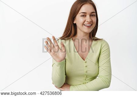 Caucasian Cheerful Woman Wave Hand, Smiling Friendly, Say Hello, Hi Gesture, Greeting You, Standing 