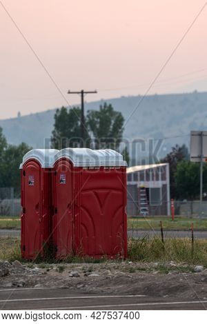Anaconda, Montana - July 11, 2021: Two Portable Bathrooms (portapotties) Outdoors, At A Construction