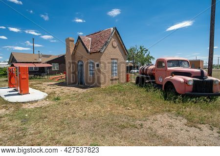 Mclean, Texas - May 6, 2021: Old Fashioned Phillips 66 Gas Stationand Old Studebaker Classic Car Tru