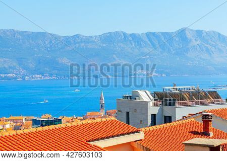 Tilled Roofs Of Budva Town In Montenegro . City Situated At The Adriatic Sea Coast