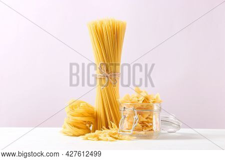 Different Types Of Pasta Close-up On A Colored Background