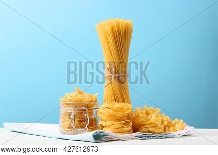 Different Types Of Pasta Close-up On A Colored Background