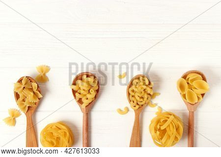 Different Types Of Pasta Close-up On A Colored Background