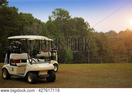 Golfcar In Beautiful Golf Course In The Evening Golf Course With Sunshine In Thailand