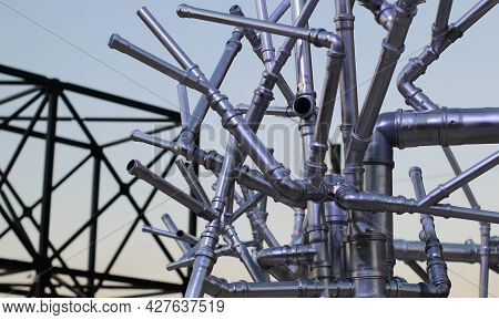 Metallic Pipe Network Chaotic Structure Stock Photo