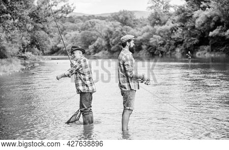 Get Hobby. Hobby And Sport Activity. Trout Bait. Male Friendship. Family Bonding. Two Happy Fisherma