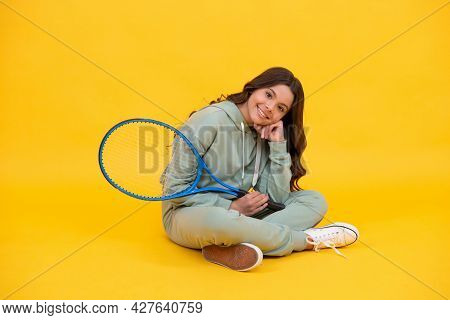 Happy Childhood. Kid In Sportswear Hold Racket. Child With Racquet. Teen Girl Relax After Sport