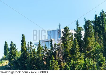 Idyllic House In Summer Day Among The Trees