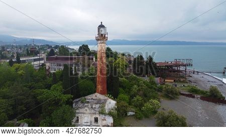 The Old Lighthouse In The City Of Sukhum In The Republic Of Abkhazia. Cloudy Day May 17, 2021
