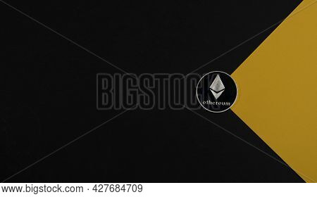 Ethereum Or Eth Silver Coin On Black And Yellow Banner With Copy Space For Text And Light Beam. Cryp