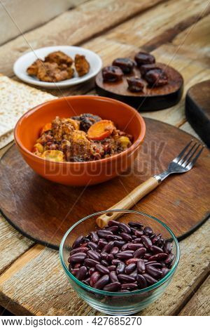 Jewish Dish Shuttle With Meat On The Table In A Plate Near The Ingredients. Vertical Photo