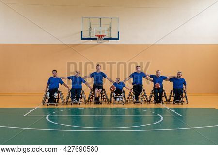 photo of the basketball team of war invalids with professional sports equipment for people with disabilities on the basketball court