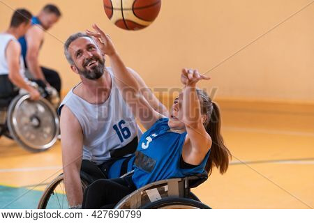 a young woman playing wheelchair basketball in a professional team. Gender equality, the concept of sports with disabilities. 