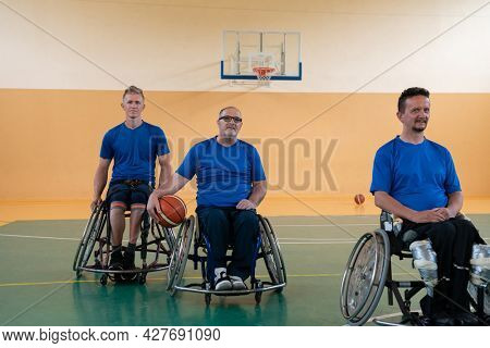 photo of the basketball team of war invalids with professional sports equipment for people with disabilities on the basketball court