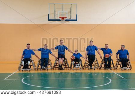 photo of the basketball team of war invalids with professional sports equipment for people with disabilities on the basketball court