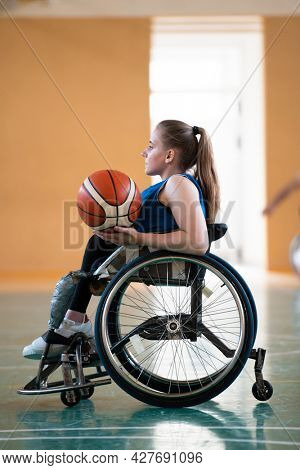 photo of the basketball team of war invalids with professional sports equipment for people with disabilities on the basketball court