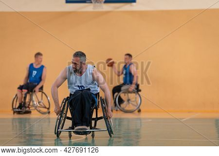 a photo of a war veteran playing basketball with a team in a modern sports arena. The concept of sport for people with disabilities