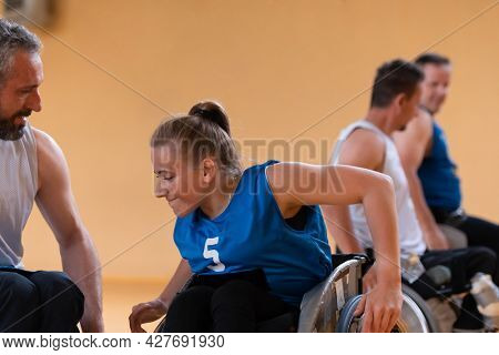 a young woman playing wheelchair basketball in a professional team. Gender equality, the concept of sports with disabilities. 