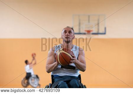 a photo of a war veteran playing basketball with a team in a modern sports arena. The concept of sport for people with disabilities
