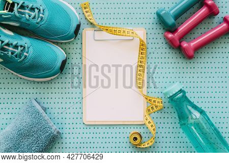 Fitness Workout Concept With Clipboard. High Quality Beautiful Photo Concept
