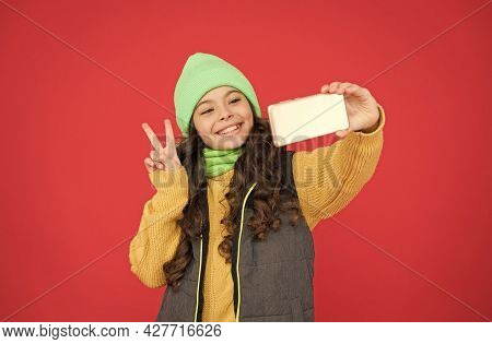 Merry Christmas Greeting. New Year Congratulations. Happy Teen Girl Making Selfie With Smartphone. X