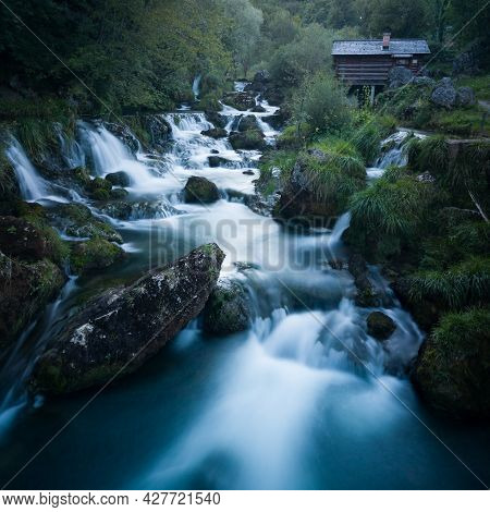 Small Traditional Wooden Water Mill By The Wild River Krupa With Big Rocks And Cascades On Popular T
