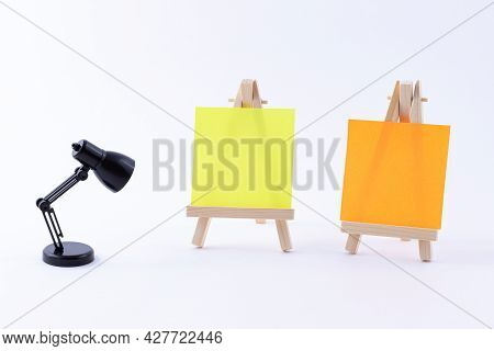 Two Wooden Easels Miniature With Blank Colored Square Canvas Or Memo Paper - Mockup. Mini Wooden Sta