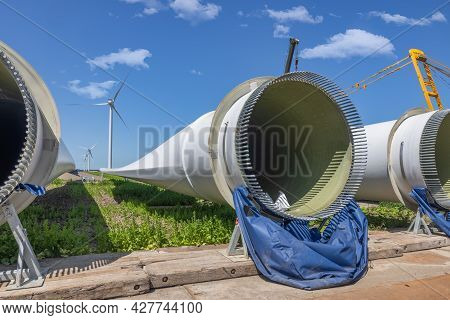 Dutch Construction Site New Wind Turbine Farm In Zeewolde With Wings And Bolts Ready To Install