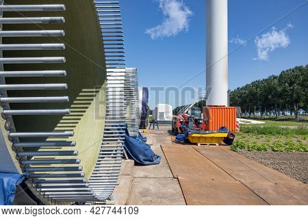 Dutch Construction Site New Wind Turbine Farm In Zeewolde With Wings And Bolts Ready To Install