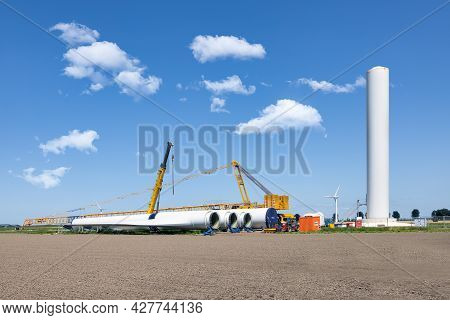Zeewolde, The Netherlands - Juli 17, 2021: Dutch Construction Site New Wind Turbine Farm In Zeewolde