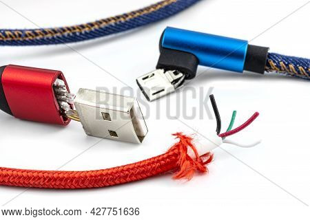 Macro Shot Of The Red And Blue Damaged End Of The Usb 2.0 A-type And Micro-b Cable, Isolated On A Wh