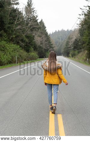 Future Concept. Highway Road Among Forest With Walking Girl.