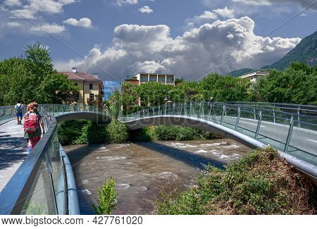 Bolzano, Italy, June 2021. The Pedestrian Bridge That Crosses The River Recalls The Structure Of The