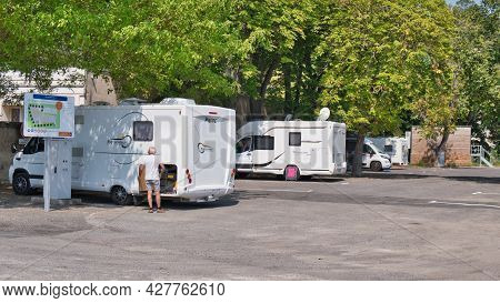 Limoux Aude France 07.22.21 Motor Homes Parked In Town Centre Facility. Man Shorts And Tee Shirt Ins