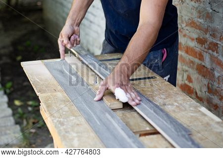 The Wooden Plank Is Sawn Lengthwise On The Machine. Carpentry Work.